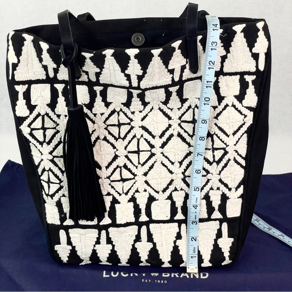 Lucky Brand Fabric Tote Bag with a stylish tassel!
Brand New